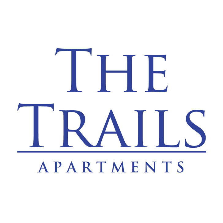 The image shows a logo for "The Trails Apartments" with blue text on a white background.